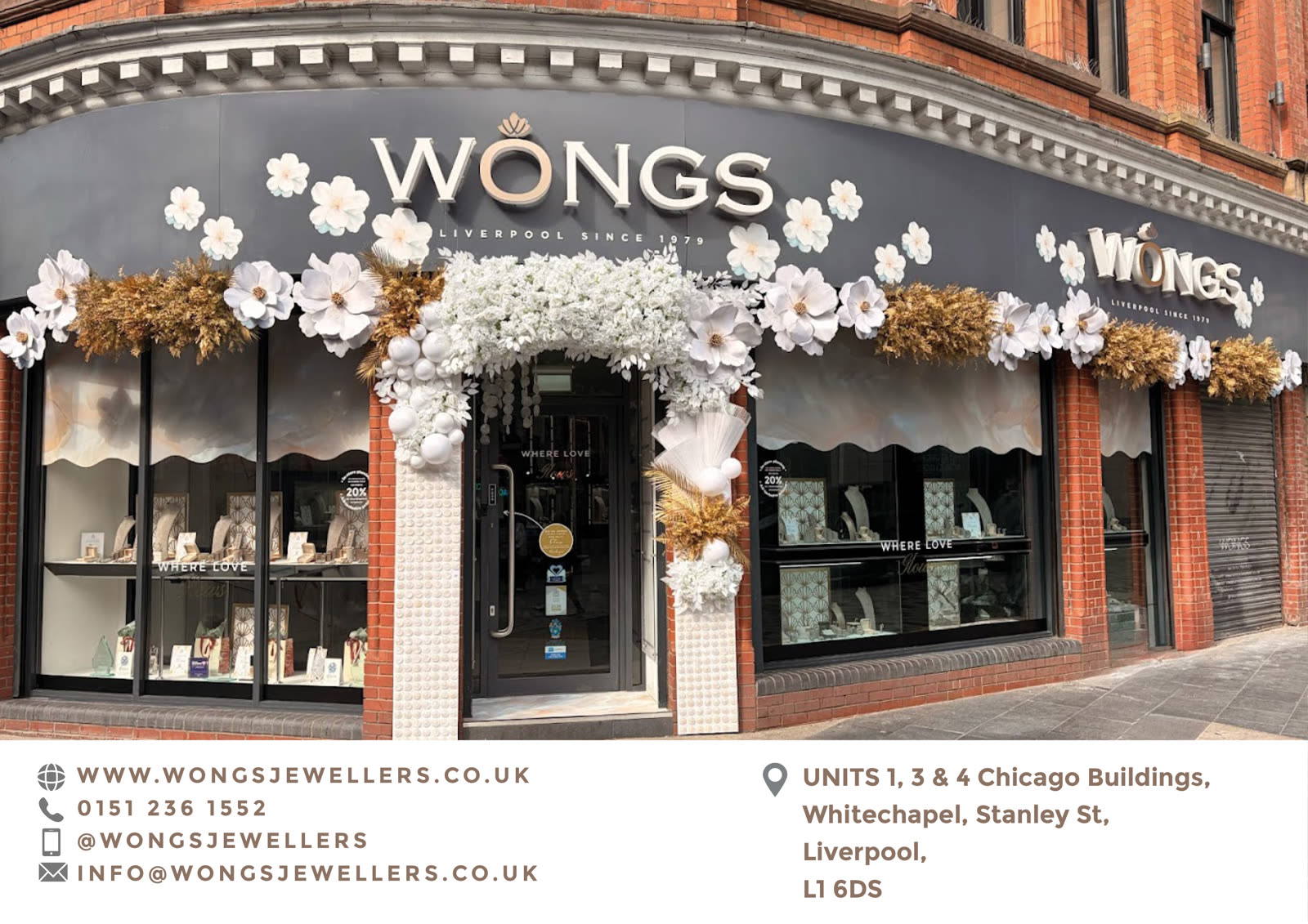 Wongs the Jewellers storefront on Whitechapel, Liverpool, decorated with white and gold florals above the entrance